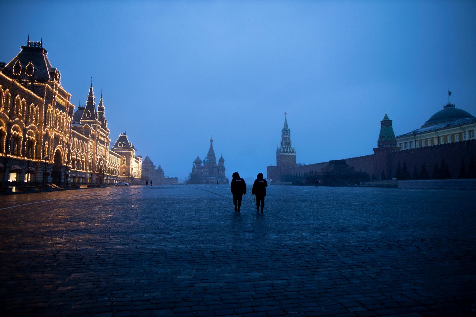 Two police officers in Moscow patrol an almost empty Red Square on March 30.