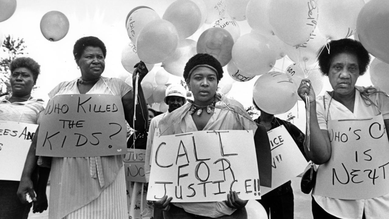 Evelyn Miller, Willie Mae Mathis, Sheila Baltazar and Annie Hill, mothers of the missing and murdered kids of Atlanta, prepare for a second annual memorial march in 1984. (Courtesy of Georgia State University/AP/HBO)