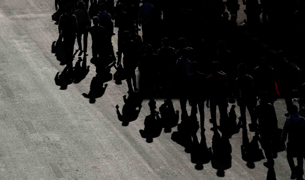 Migrant workers walk home from New Delhi.