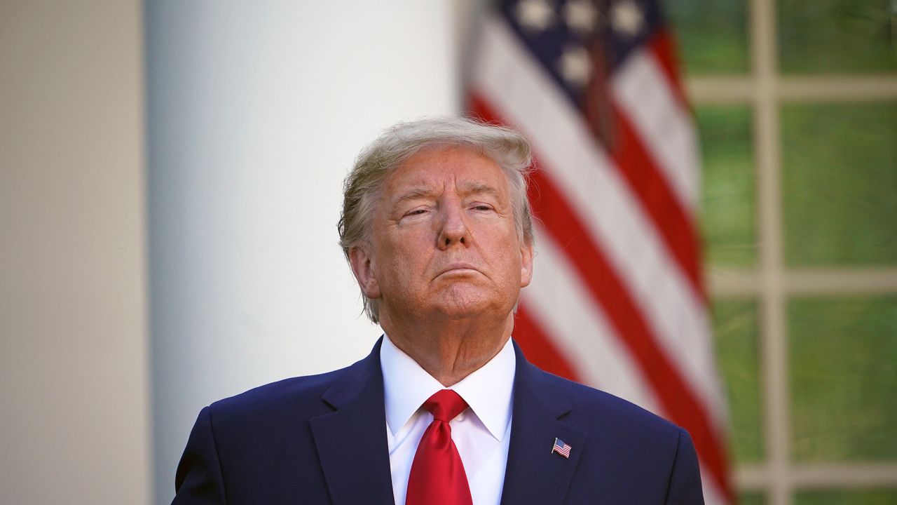 US President Donald Trump looks on during the daily briefing on the novel coronavirus, COVID-19, in the Rose Garden of the White House in Washington, DC, on March 30, 2020. (Photo by MANDEL NGAN / AFP) (Photo by MANDEL NGAN/AFP via Getty Images)