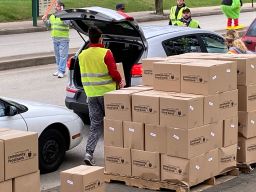 Cars lined up to receive groceries from the Greater Pittsburgh Community Food Bank on Monday.