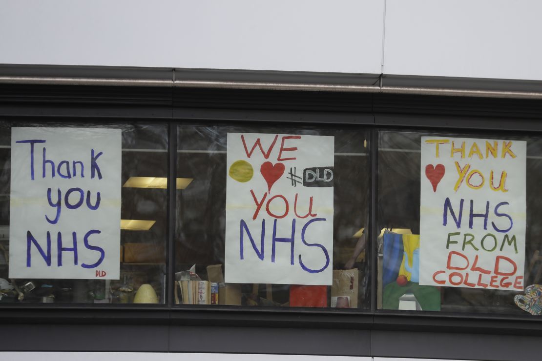 Support for National Health Service staff fighting the coronavirus outbreak has been displayed in signs and applause.