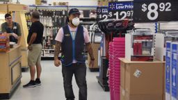 A Walmart employee wearing a facial mask on March 15,2020. Stores ran out of food, cleaning and papers supplies as shoppers feared the Coronavirus outbreak in Hallandale, Florida. (Photo by Michele Eve Sandberg/Shutterstock)