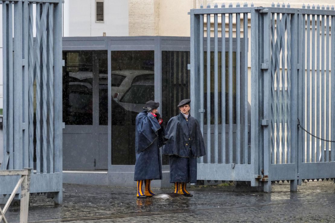Swiss Guards stand at an entrance gate to the Vatican during Italy's lockdown.