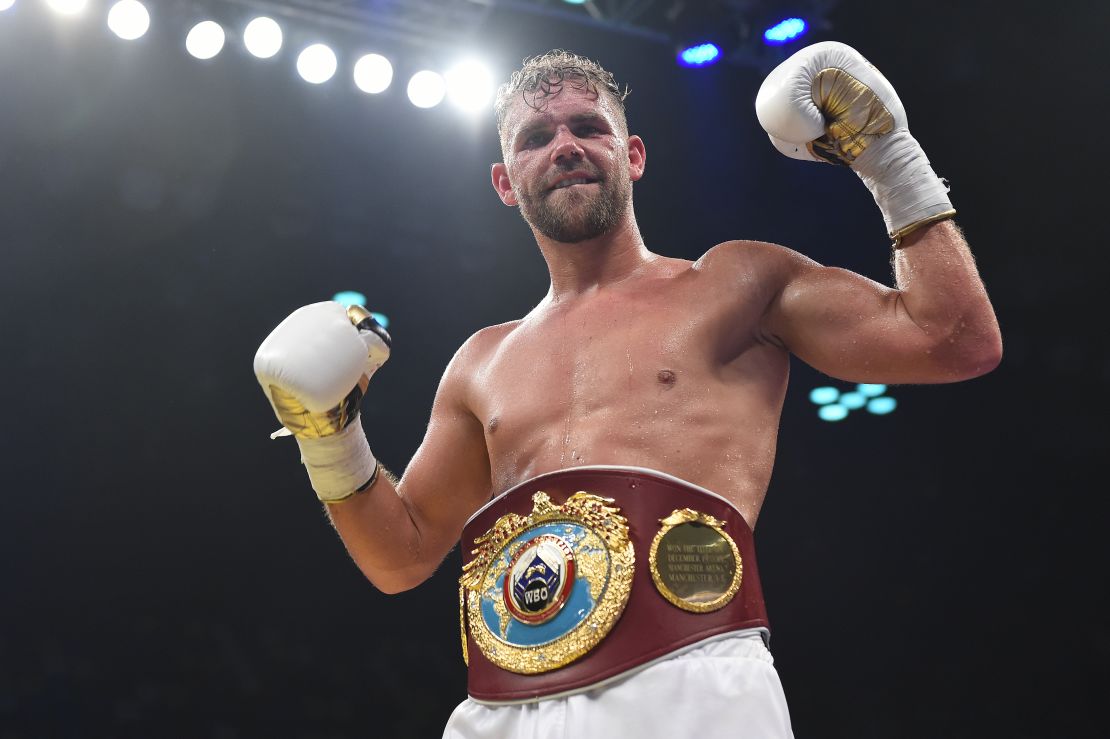 Saunders celebrates defeating Willie Munroe Jr. for the WBO world middleweight title.