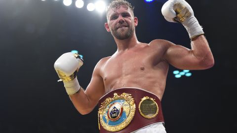 Saunders celebrates defeating Willie Munroe Jr. for the WBO world middleweight title.