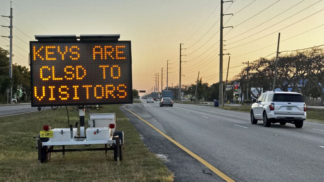 Cars pass an electronic message on the Florida Keys Overseas Highway last week. 