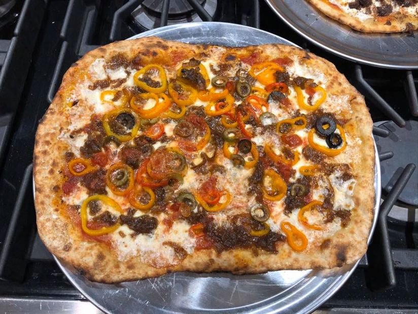 Susan Weiller and her husband, Ken, have been making pizzas while stuck at home in New Rochelle, New York. This one was made with a homemade crust and topped with tomato sauce, caramelized onions, sweet peppers and mozzarella. "Knowing we had pizza dough in the freezer, we started scavenging through the freezer and fridge to find things that would work!" she said.