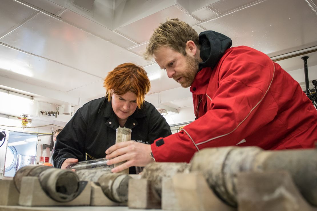 Tina van de Flierdt and Johann Klages work on the sample of ancient soil.