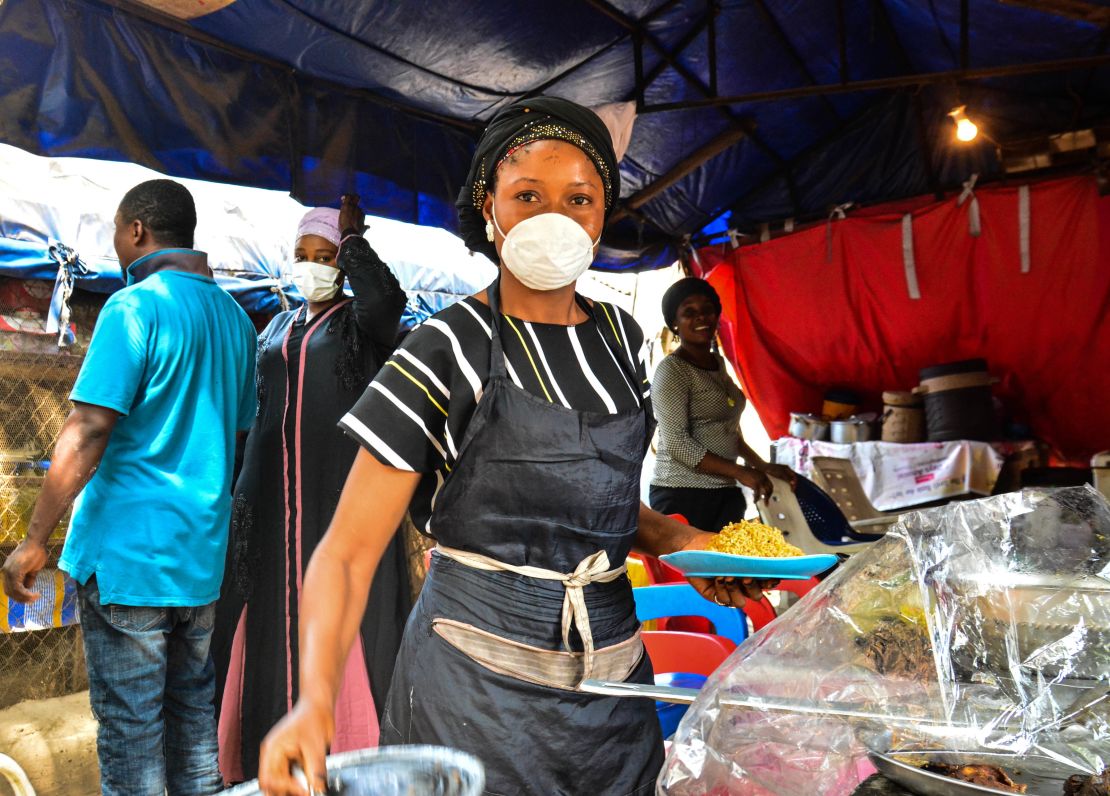 A food seller in Abuja, Nigeria's capital tells CNN she cannot afford to stay at home. Picture by Osaze Efe. 