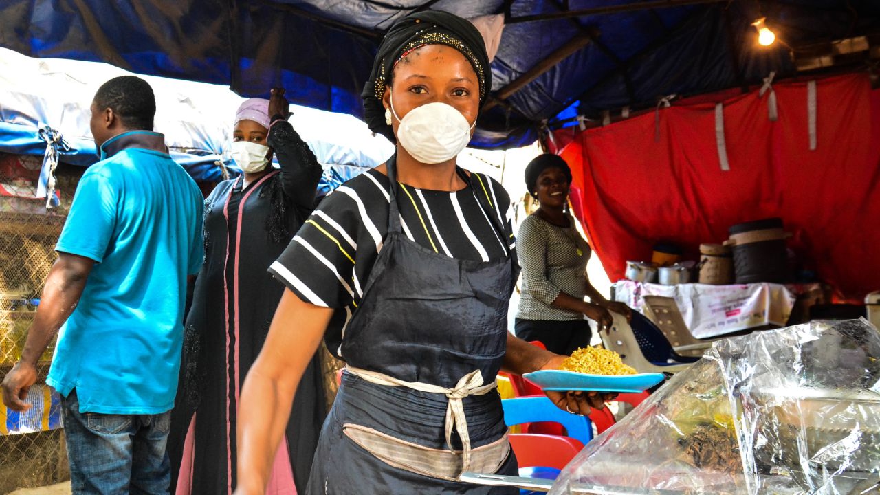 A food seller in Abuja, Nigeria's capital tells CNN she cannot afford to stay at home. Picture by Osaze Efe.