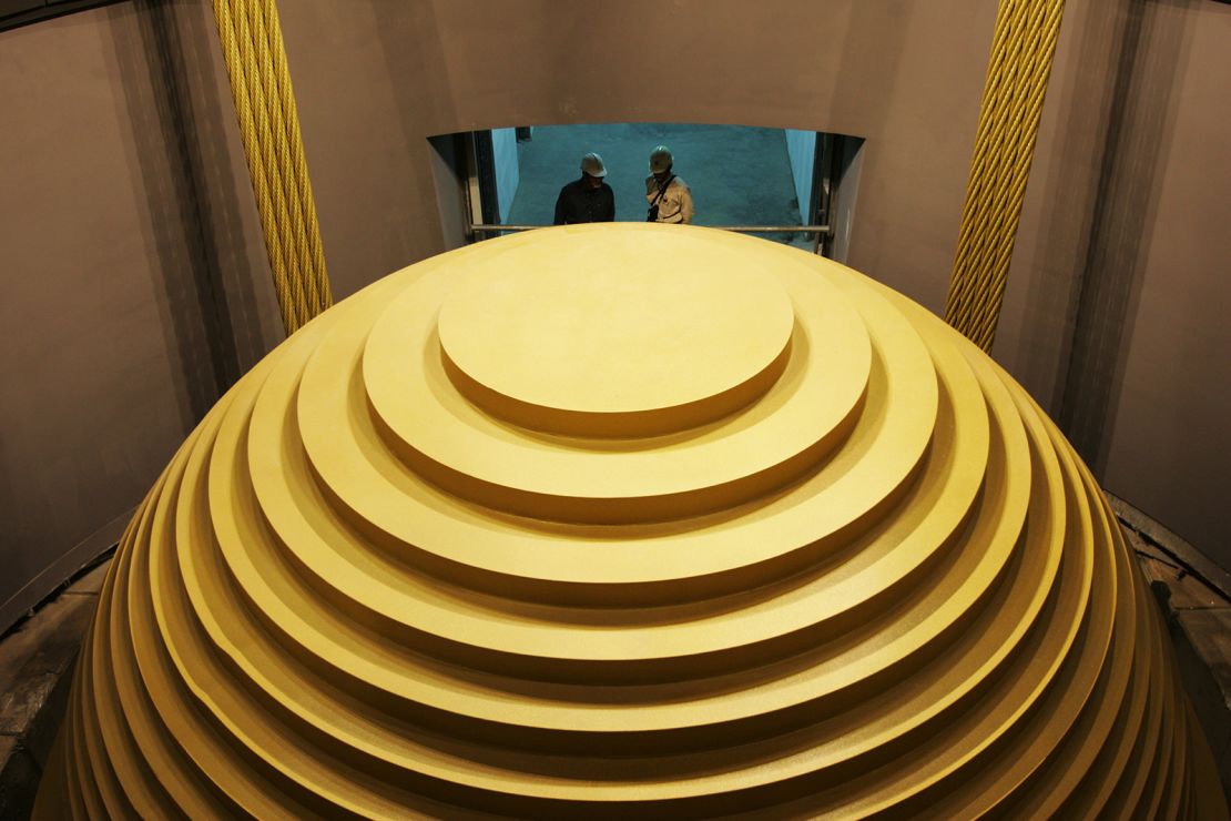 A 660-ton spherical device called a tuned mass damper swings like a giant pendulum in the skyscraper's upper floors.