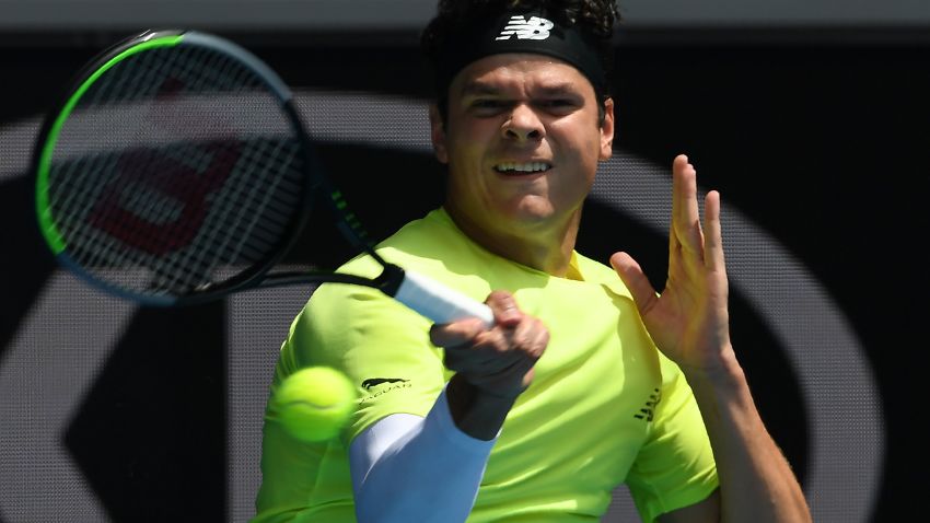 Canada's Milos Raonic hits a return against Croatia's Marin Cilic during their men's singles match on day seven of the Australian Open tennis tournament in Melbourne on January 26, 2020. (Photo by Greg Wood / AFP) / IMAGE RESTRICTED TO EDITORIAL USE - STRICTLY NO COMMERCIAL USE (Photo by GREG WOOD/AFP via Getty Images)