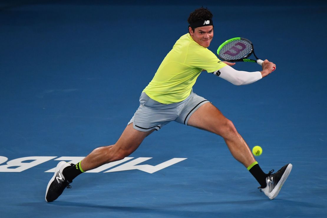 Milos Raonic plays a backhand against Novak Djokovic at this year's Australian Open. 