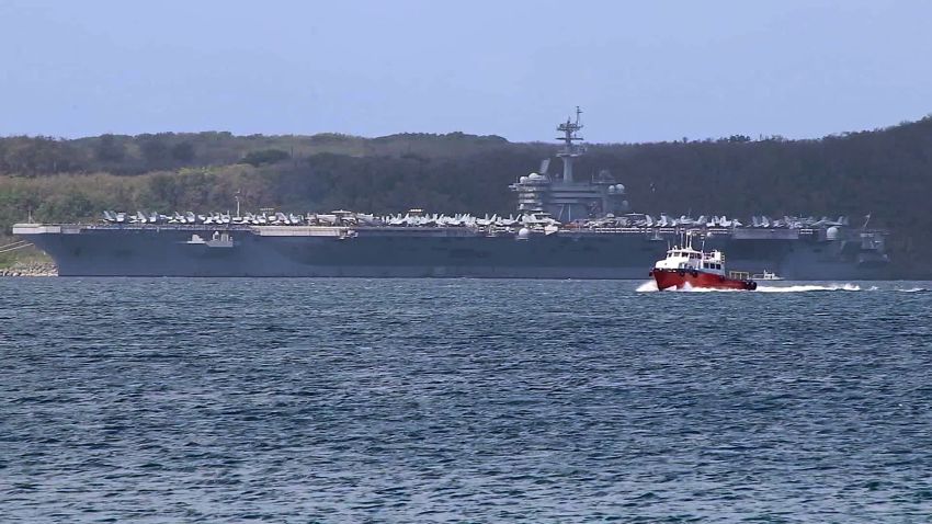 USS Theodore Roosevelt aircraft carrier sits on the outskirts of Apra Harbor, Guam, on April 1. At least 70 sailors have tested positive for coronavirus aboard the aircraft carrier.