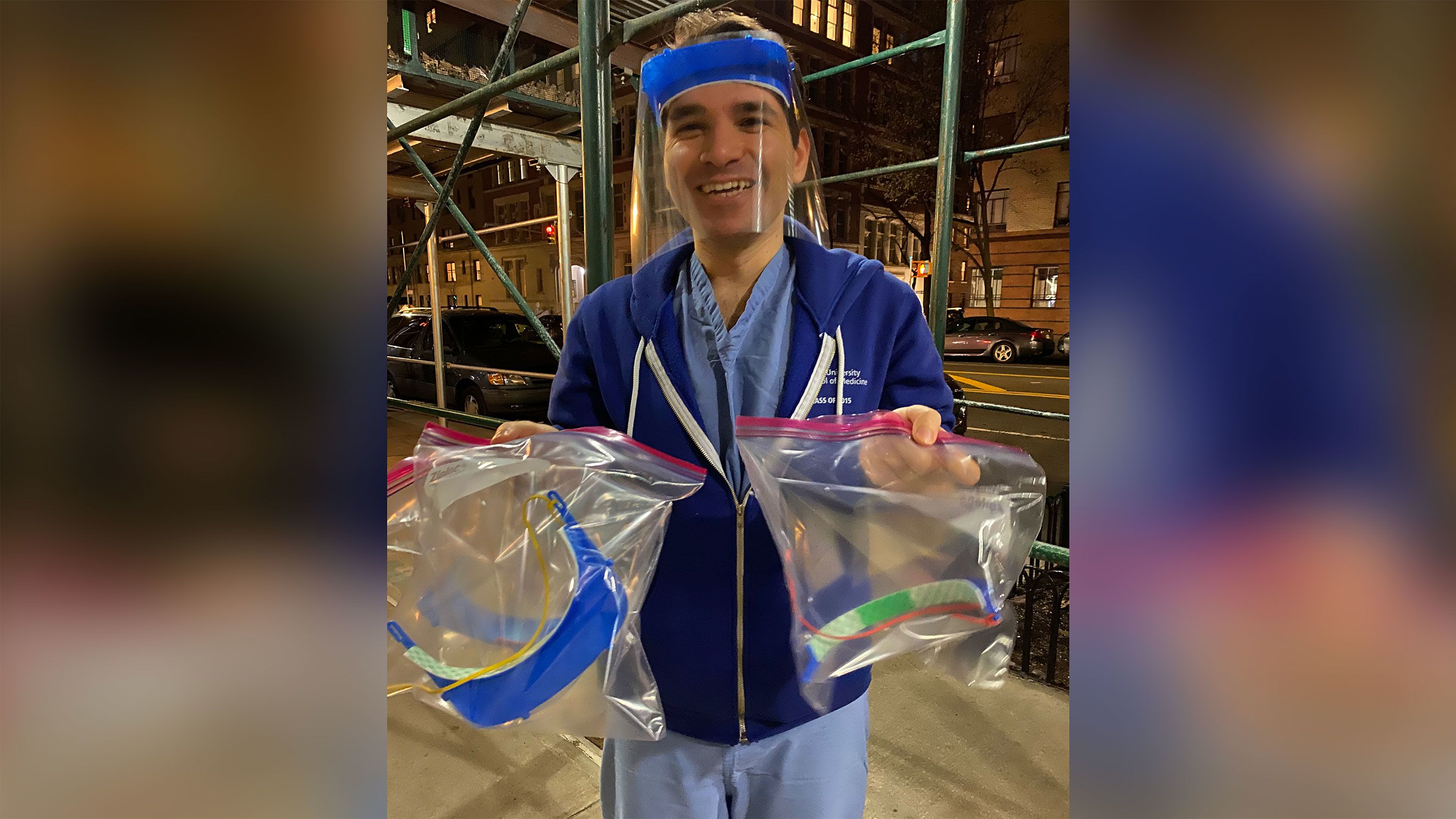 Dr. Pierre Elias holds the first face shields donated to his colleagues. 