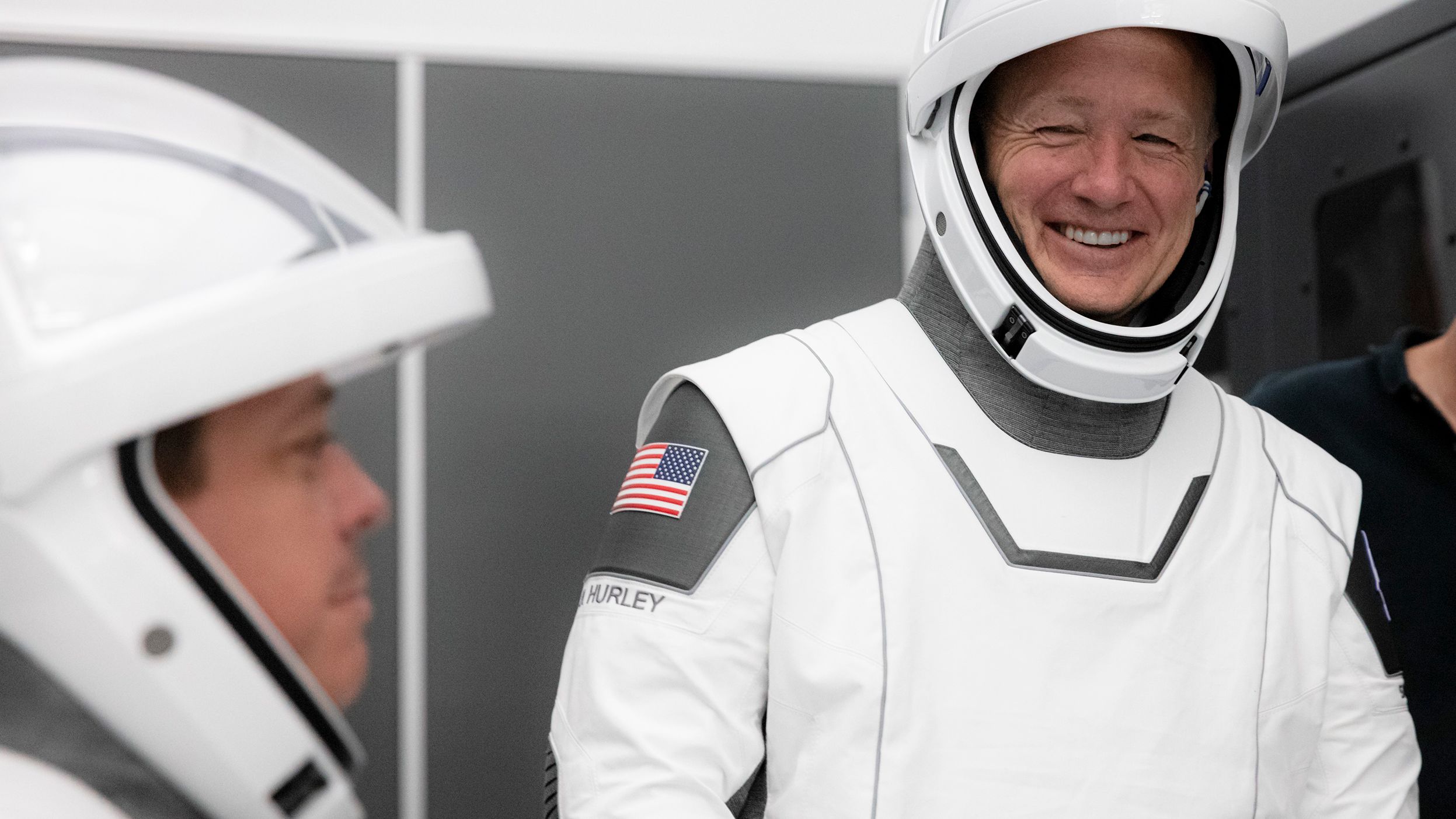 NASA astronauts Bob Behnken (left) and Doug Hurley participate in SpaceX's flight simulator.