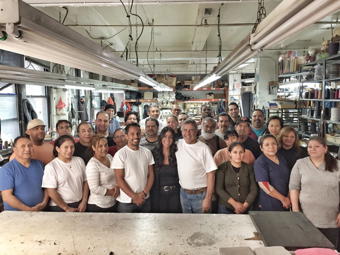 The employees of Pietro Handbags pose for a photo in their factory in New York City.