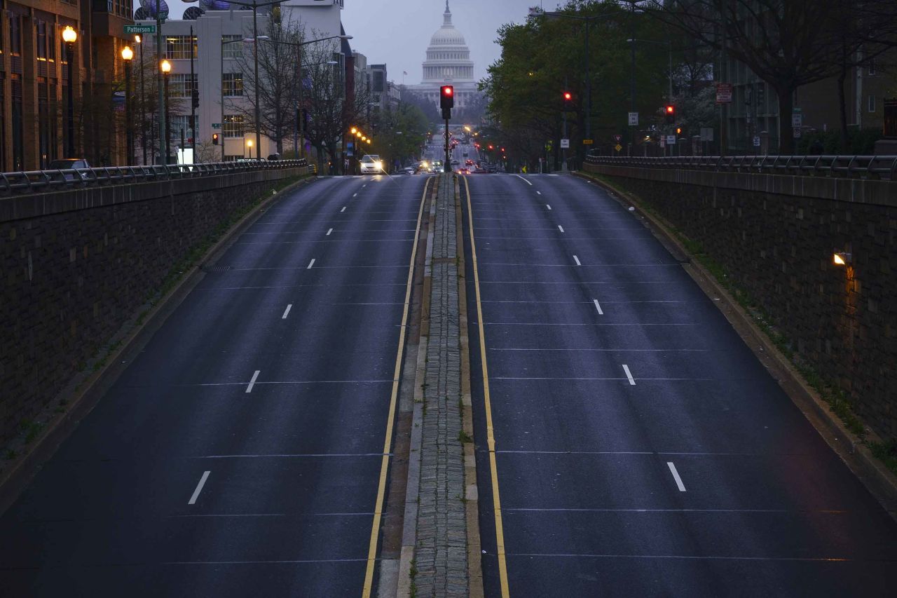 In Washington, a mostly empty North Capitol Street is seen at dusk on March 31.