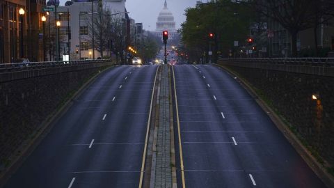 In Washington, a mostly empty North Capitol Street is seen at dusk on March 31.