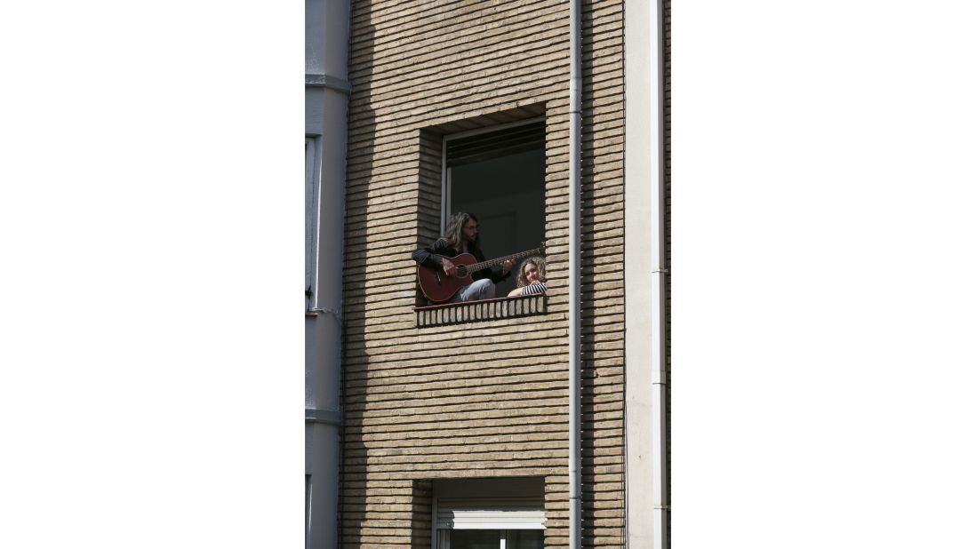 <strong>Zaragoza, Spain:</strong> Neighbors Nacho and Laura join in on Karimeh's guitar playing, turning it into a balcony jam session.