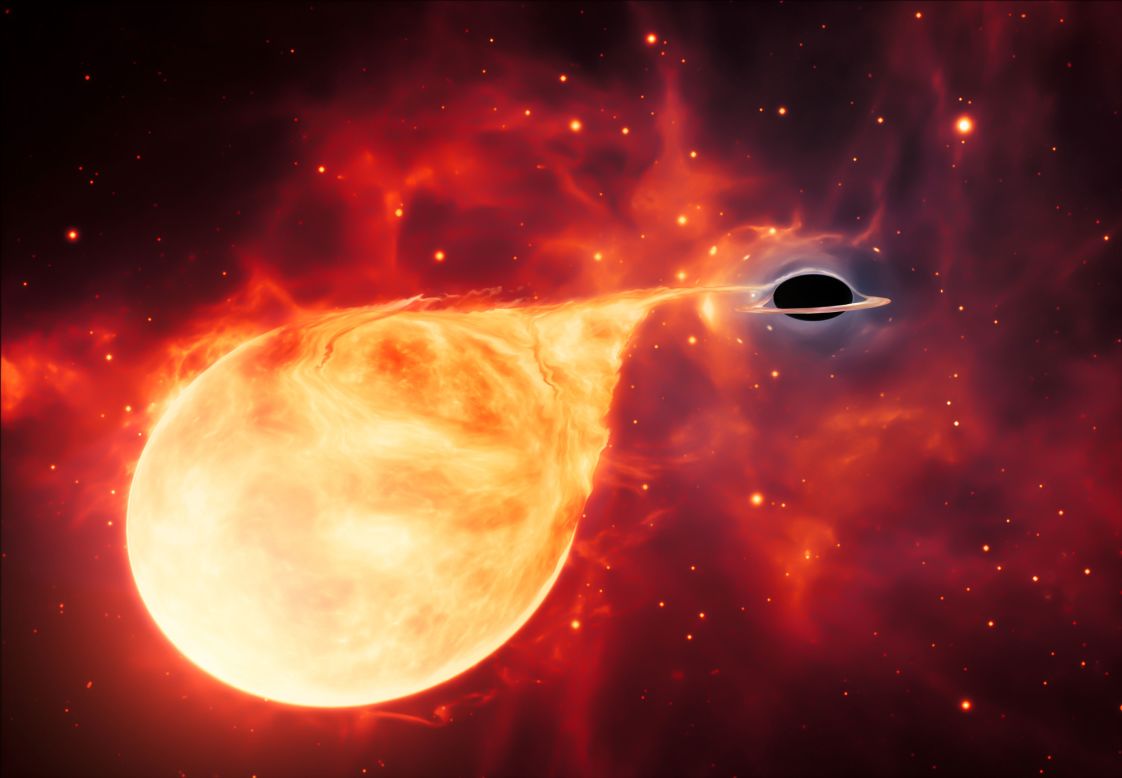 This artist's illustration shows an intermediate-mass black hole tearing into a star.