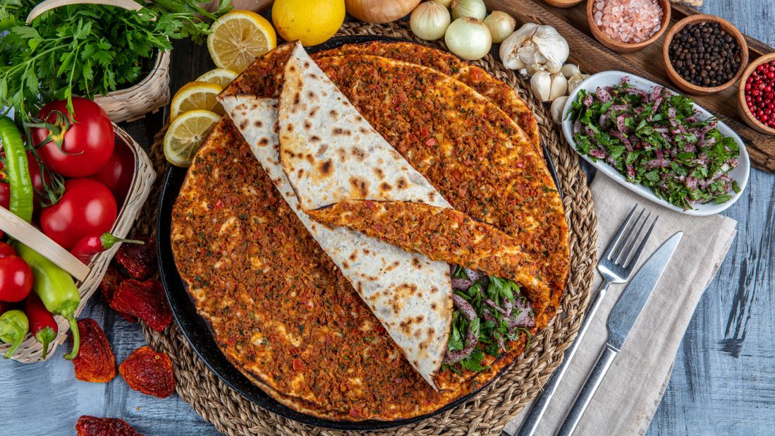 <strong>Lahmacun:</strong> A type of flatbread, commonly referred to as Turkish pizza, made from meat and a paste consisting of low-fat mince stirred together with tomato paste, garlic and spices.