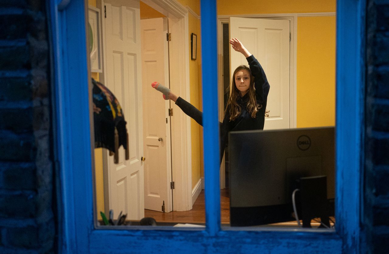 London-based photographer Suzanne Plunkett took this photo of her friend's daughter while she attended an online ballet lesson during the lockdown.