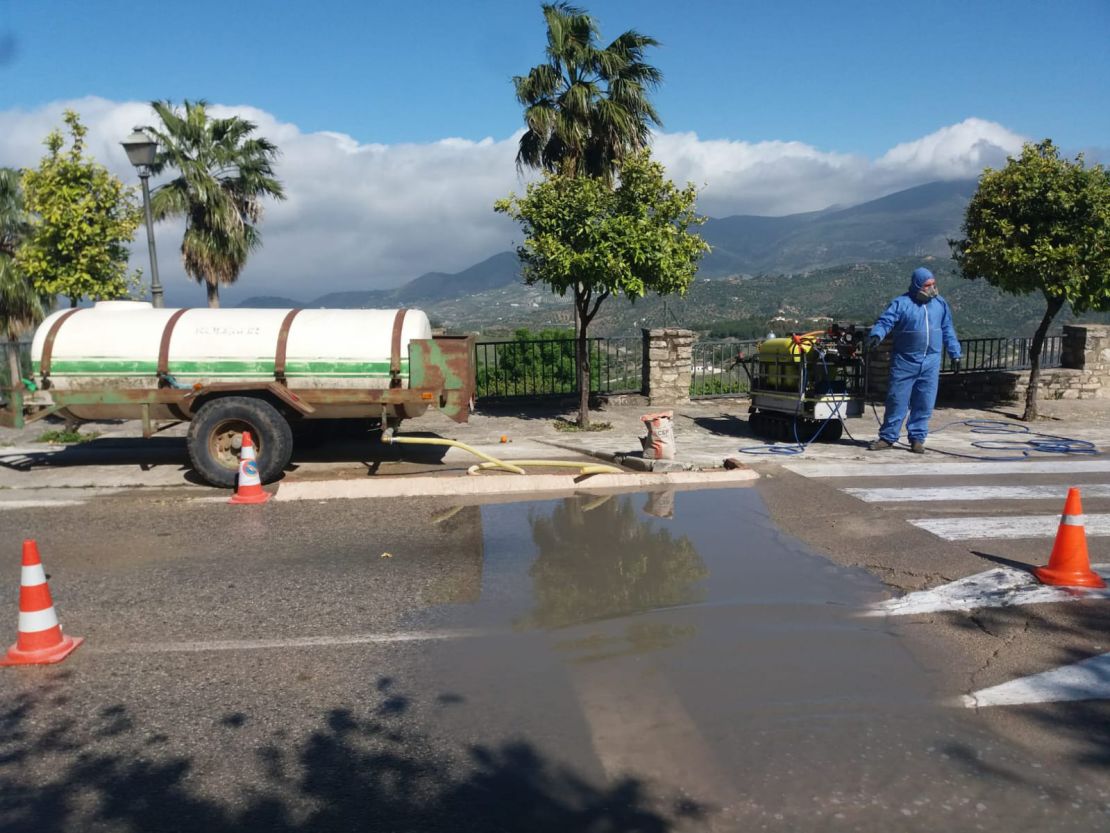 Four of the town's entrances were blocked, leaving just one, which has a manned checkpoint where vehicles are sprayed with a mix of bleach and water.