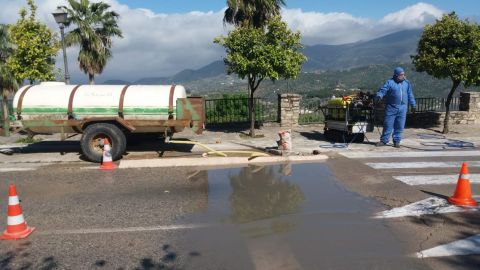 Four of the town's entrances were blocked, leaving just one, which has a manned checkpoint where vehicles are sprayed with a mix of bleach and water.