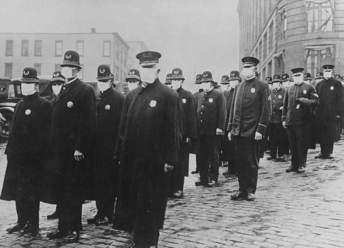 Seattle policemen wear face masks during the influenza epidemic of 1918, which claimed millions of lives worldwide.