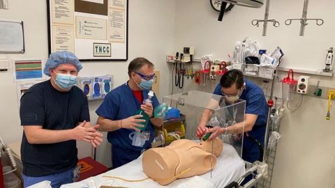 A doctor at Norwood Hospital in Massachusetts simulates intubating a patient with one of Katz' intubation boxes.