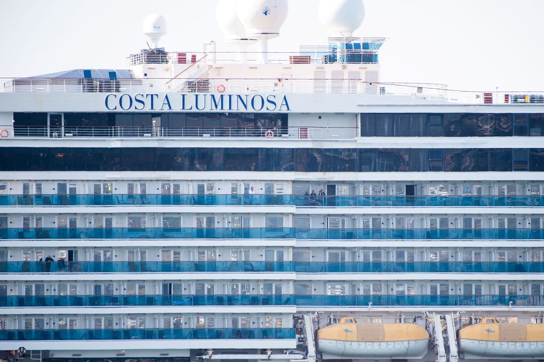 Costa Luminosa passengers  are seen as the ship is moored in the harbor in Marseille, France.