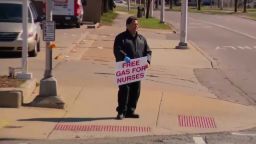 Allen Marshall holds a sign reading 'free gas for nurses' in Detroit on April 2.
