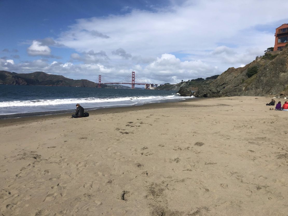 A near empty China Beach in view of the Golden Gate Bridge indicates that San Franciscans are abiding by the stay-at-home mandate.
