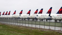 KANSAS CITY, MISSOURI - APRIL 03:  Planes belonging to Delta Air Lines sit idle at Kansas City International Airport on April 03, 2020 in Kansas City, Missouri. U.S. carriers reported an enormous drop in bookings amid the spread of the coronavirus and are waiting for a government bailout to fight the impact. Delta lost almost $2 billion in March and parked half of its fleet in order to save money. (Photo by Jamie Squire/Getty Images)