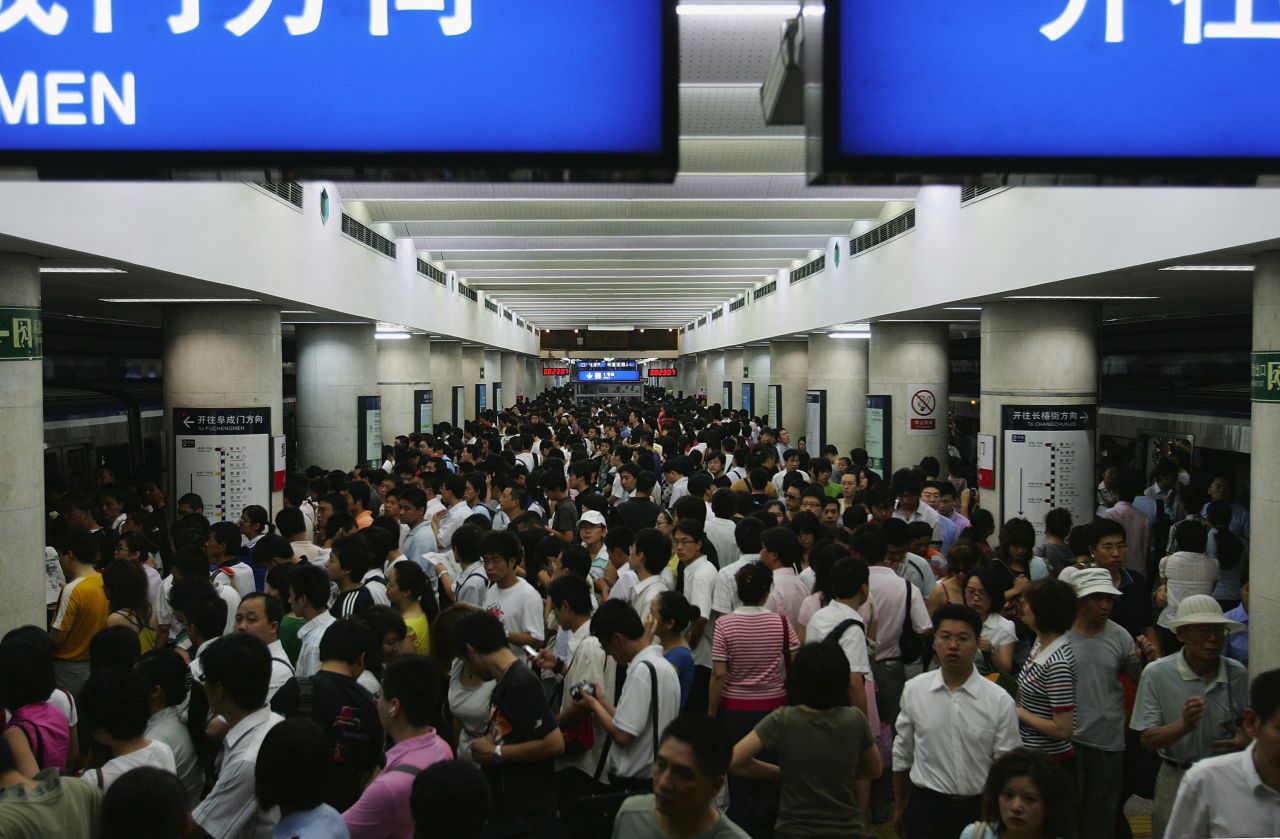 Commuters crowd the subway in Beijing in July 2008. China has traditionally had some of the world's lowest rates of baldness, though changes to people's lifestyles are contributing to an increase in hair loss. 