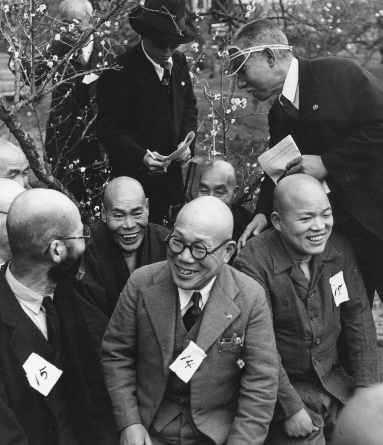 A judge examines finalists at a 1957 baldness competition in Japan, where rates of hair loss have historically been among the world's lowest.