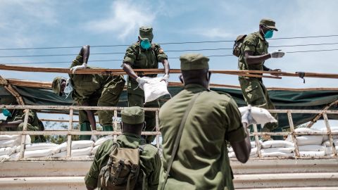 Paramilitary members unload provisions in Kampala, Uganda, on April 4, 2020. It was the first day of government food distribution for people affected by the nation's lockdown.