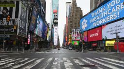 View of an almost empty Time Square on April 03, 2020 in New York. - In New York, the epicenter of the US outbreak, Mayor Bill de Blasio urged residents to cover their faces when outside and Vice President Mike Pence said there would be a recommendation on the use of masks by the general public in the next few days. (Photo by Angela Weiss / AFP) (Photo by ANGELA WEISS/AFP via Getty Images)