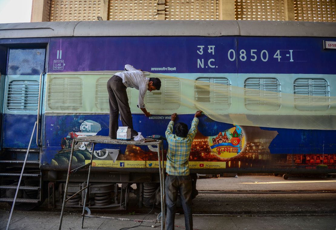 Labourers work on train coaches that will be used as temporary isolation wards in preparation for coronavirus-infected patients during a government-imposed nationwide lockdown as a preventive measure against the Covid-19 coronavirus, at a workshop in Allahabad on April 4, 2020.