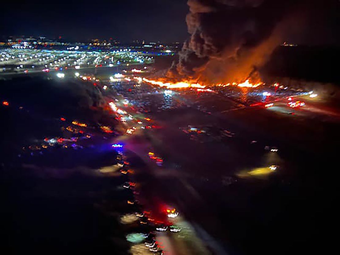 The fire sent plumes of smoke into the air near the airport.