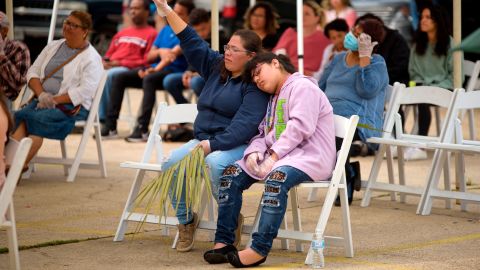 Parishioners attend a Palm Sunday worship service at City On A Hill Church in Houston, Texas. The service was held in the church's parking lot and the church practiced social distancing during the service.
