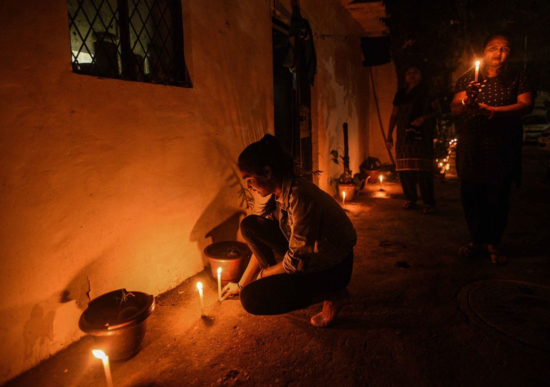 Indians light candles in a show of solidarity with health workers on the frontlines.