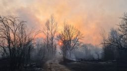 This picture taken on April 5, 2020, shows a forest fire burning at a 30-kilometer (19-mile) Chernobyl exclusion zone, not far from the nuclear power plant. - Ukrainian authorities on April 5 reported a spike in radiation levels in the restricted zone around Chernobyl, scene of the world's worst nuclear accident, caused by a forest fire. "There is bad news - radiation is above normal in the fire's center," Yegor Firsov, head of Ukraine's state ecological inspection service, said on Facebook. (Photo by Yaroslav EMELIANENKO / AFP) (Photo by YAROSLAV EMELIANENKO/AFP via Getty Images)