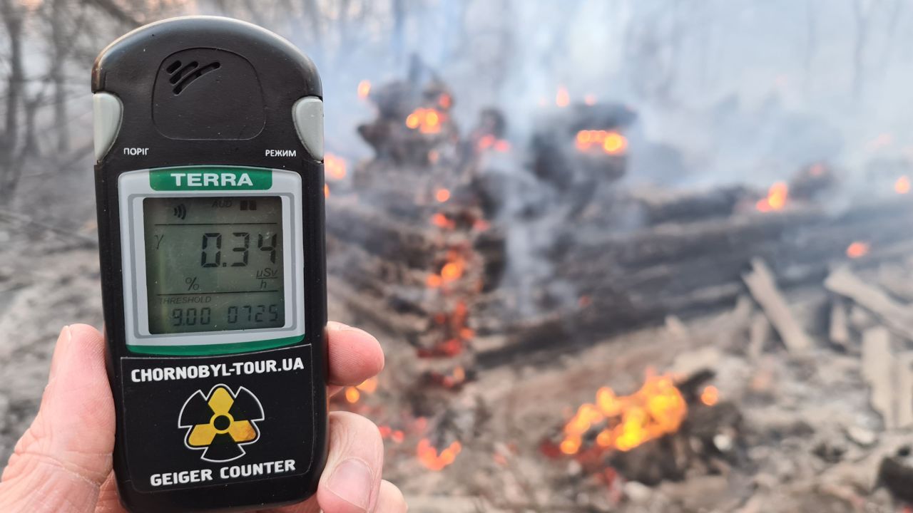 A Geiger counter near the site of the fire on Sunday shows a radiation level slightly below the maximum permissable amount. Other footage taken near the fire shows higher readings.