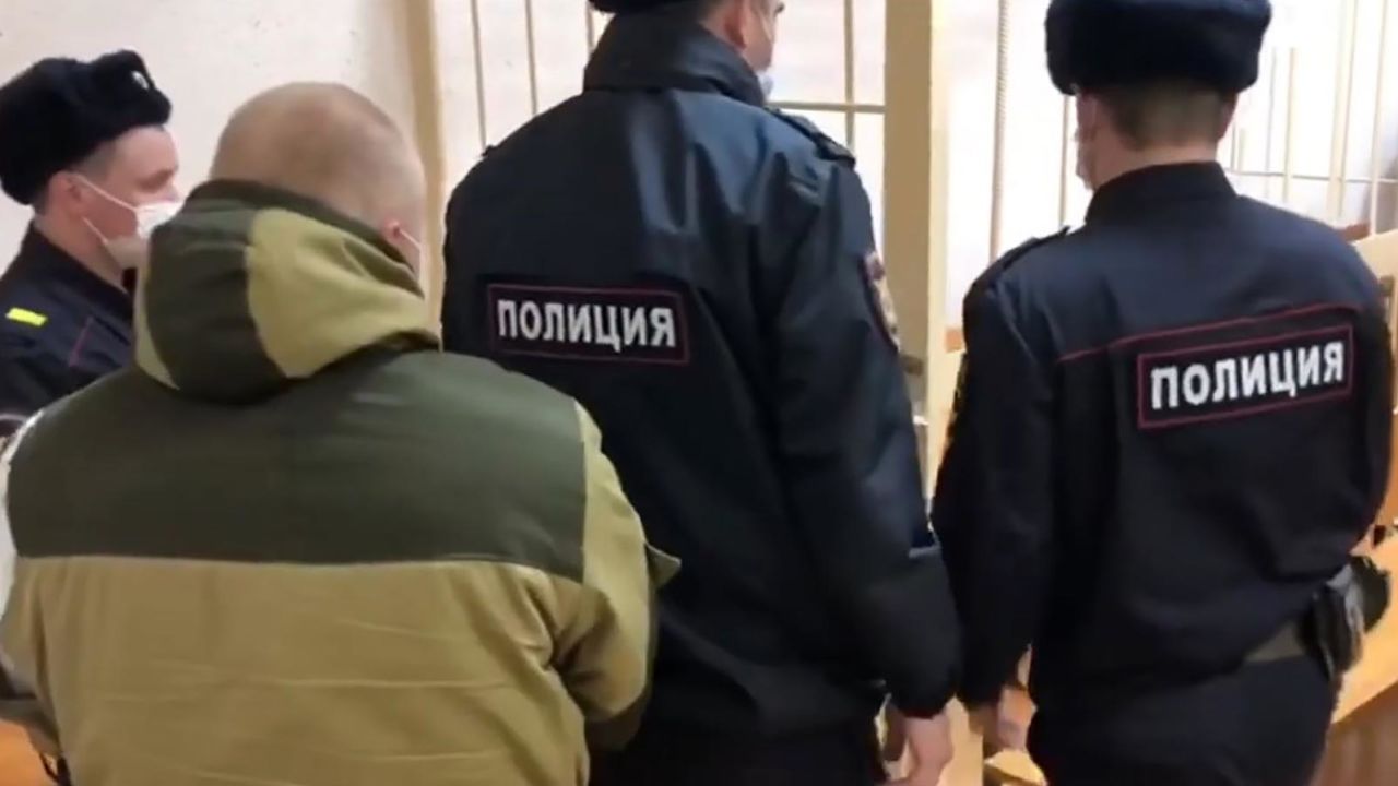 A man was detained in connection with a mass shooting in an apartment building in the village of Yelatma, seen here (left) during a hearing at Kasimovsky District Court.