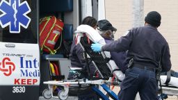 FDNY paramedics bring a patient to Wyckoff Hospital in the Bushwick section of Brooklyn April 5, 2020 in New York. - The coronavirus death toll in New York state spiked to 4,159, the governor said, up from 3,565 a day prior. The toll increase of 594 showed a slight decrease in the day-to-day number of lives lost compared to the previous day.  Governor Andrew Cuomo told journalists it was too soon to tell whether the decrease from the previous record of 630 deaths in one day was statisically significant. (Photo by Bryan R. Smith / AFP) (Photo by BRYAN R. SMITH/AFP via Getty Images)