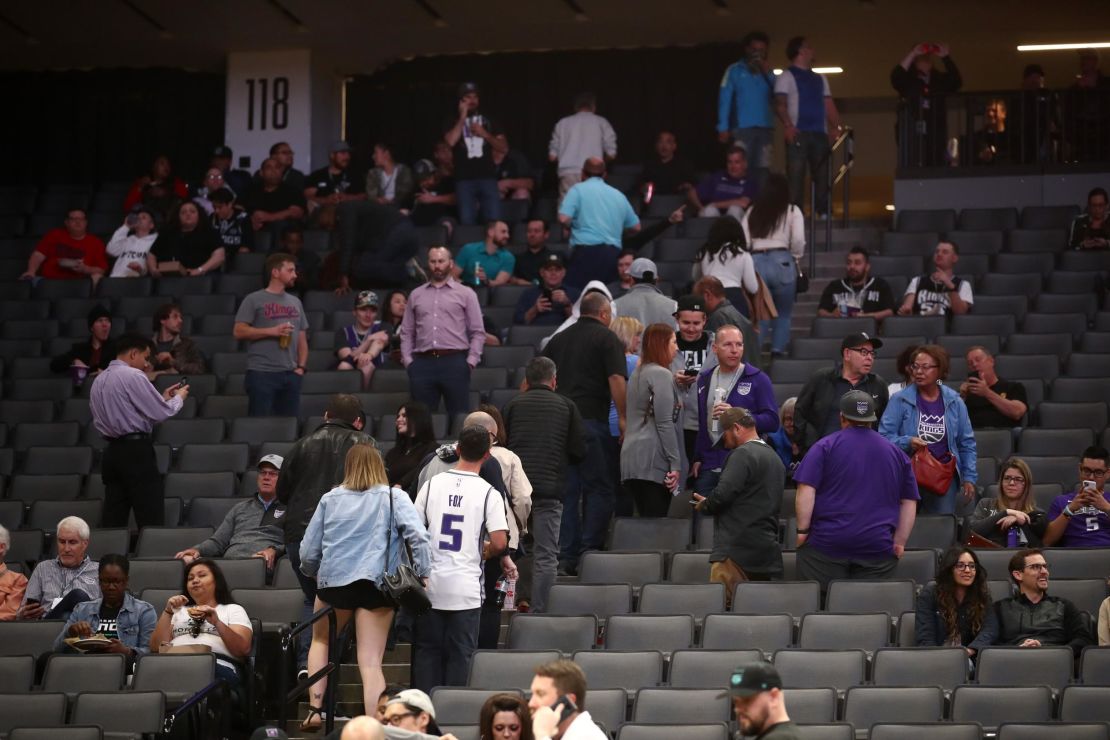 Fans leave the building after the Sacramento King game against the New Orleans Pelicans was postponed due to the coronavirus outbreak.