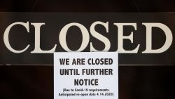 A notice of closure is posted at The Great Frame Up in Grosse Pointe Woods, Mich., Thursday, April 2, 2020.